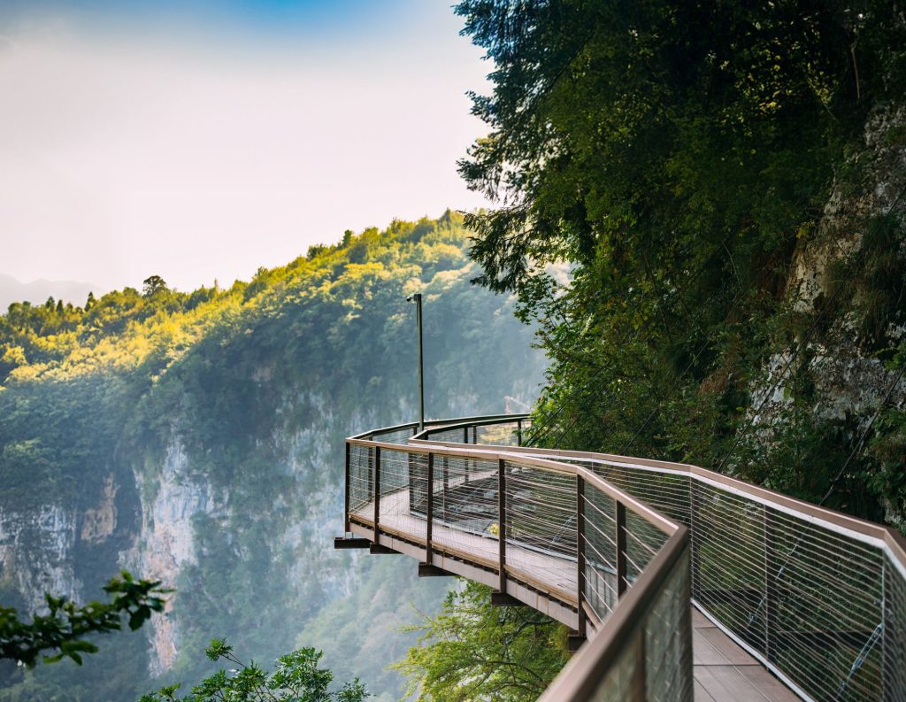 Georgia emerges as the ultimate spring escape showcasing a narrow suspension bridge high above Okatse Canyon